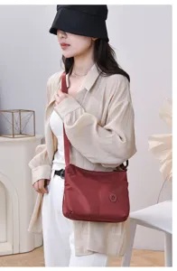 Nylon shoulder bag detail featuring casual style, large capacity, and elegant design.