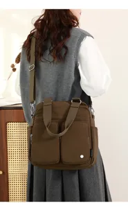 Multi-pocket nylon crossbody bag, casual shoulder handbag with large capacity for daily use.