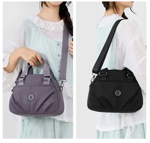 Nylon casual shoulder handbag for women, large capacity multi-pocket commuter crossbody bag.