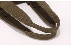 Detailed view of the durable brown woven handle strap, showcasing strong stitching quality.