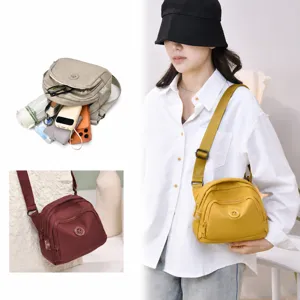 Casual nylon crossbody bag for women, lightweight multi-pocket shell shoulder bag daily use.