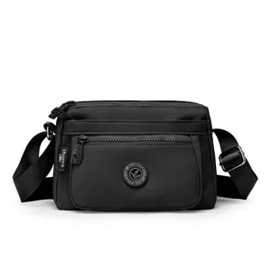 Black nylon crossbody bag for women, casual multi-pocket shoulder bag for daily casual use.
