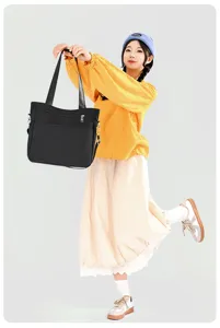 Minimalist solid color nylon shoulder bag for women, large capacity commuter tote handbag.