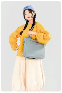 Minimalist solid color nylon shoulder bag, large capacity tote for women daily commute and school.