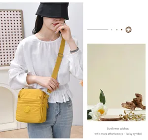 Casual multi-compartment women's nylon crossbody bag, lightweight, waterproof, and stylish bag.