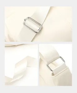 Close-up detail of the adjustable shoulder strap, durable nylon fabric and metal buckle hardware.