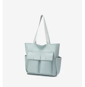 Large capacity nylon shoulder tote bag detail showcasing multiple pockets and durable straps.
