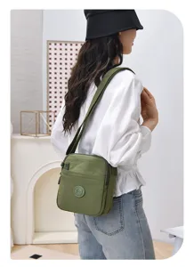 Casual nylon crossbody bag with multi-compartments, lightweight waterproof shoulder bag.