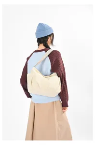 Casual slouchy multi-pocket shoulder crossbody bag detailed rear view showcasing capacity.