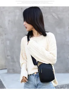 Casual nylon crossbody bag for women, lightweight black shoulder phone bag with zipper.