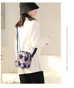 Floral print nylon crossbody bag for women, stylish mini shoulder bag with adjustable strap.