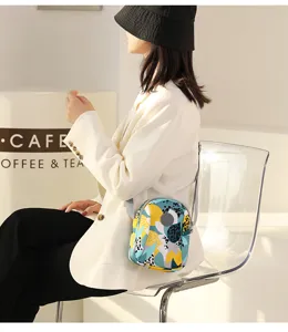 Stylish women oxford cloth mini crossbody shoulder bag with colorful floral print design.