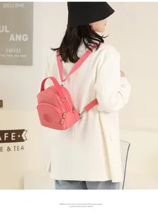 Pink oxford cloth mini convertible backpack, stylish casual multi-way daypack for women.