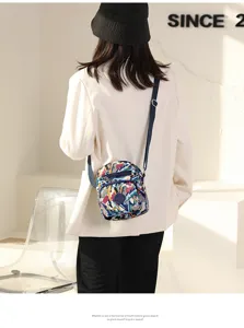 Stylish printed nylon crossbody bag with zipper and large capacity for daily casual use.