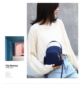 Detailed view of women's nylon crossbody bag, lightweight daily shoulder phone handbag.