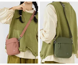 Minimalist casual crossbody bag for women, stylish small square phone bag with adjustable strap.