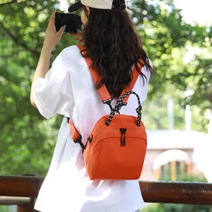 Waterproof nylon backpack for women, stylish lightweight travel and casual commuting bag.
