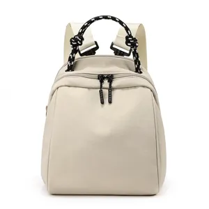 Minimalist waterproof nylon backpack for women, casual daily commuter travel daypack school bag.