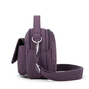 Women casual nylon crossbody bag, simple single shoulder bag with multiple zipper pockets purple.