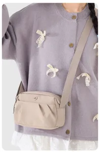 Lightweight crossbody bag for women, casual nylon shoulder phone bag with wide strap.