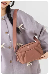 Lightweight casual crossbody bag for women, multi-layer nylon shoulder bag daily use.