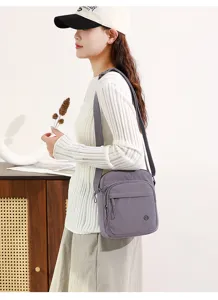 Detail view of casual lightweight cross body shoulder bag worn by model, daily style.