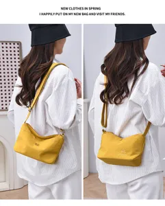 Detailed view of the casual nylon crossbody bag, solid color multi-layer storage design.