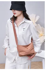 Casual nylon crossbody bag for women, compact multi-layer solid color shoulder bag, water-repellent.