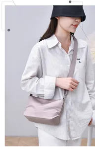 Casual nylon crossbody bag for women, versatile multi-layer solid color shoulder bag.