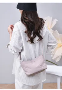 Casual nylon crossbody bag for women, versatile solid color shoulder bag with multi-layer design.