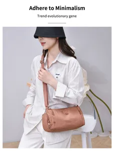 Casual nylon cylindrical shoulder bag for women, multi-pocket design stylish crossbody bag.