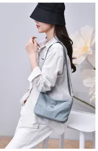 Casual nylon crossbody bag for women, multi-layer compact solid color shoulder bag for daily use.