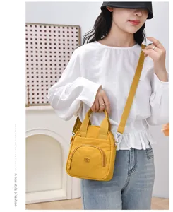 Bolso cruzado de nailon impermeable para mujer, bolso de hombro amarillo informal con correa ajustable.
