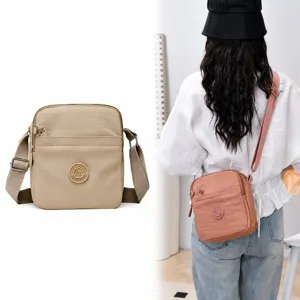 Casual multi-compartment nylon crossbody bag for women, lightweight and waterproof shoulder bag.