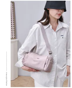 Casual nylon crossbody shoulder bag with adjustable strap and multiple storage pockets.
