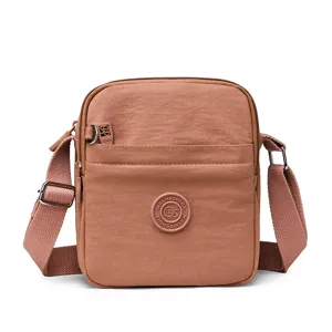 Casual multi-compartment women crossbody bag, lightweight nylon waterproof shoulder bag for daily use.