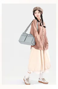 Detailed view of large capacity nylon shoulder bag for women, casual crossbody handbag style.