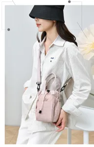 Casual pink crossbody mobile phone bag detail, featuring durable fabric and convenient drawstring.
