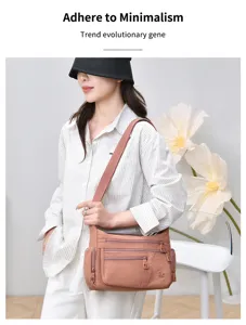 Casual multi-compartment nylon shoulder bag for women, versatile everyday commuting messenger bag.