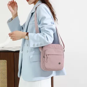 Casual lightweight pink crossbody canvas bag for women daily shopping and outdoor travel use.