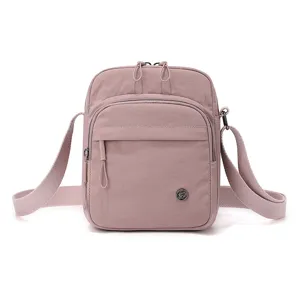 Casual crossbody shoulder bag for women, lightweight nylon daily purse with zipper pockets.