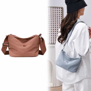 Casual lightweight nylon crossbody shoulder bag for women, multi-pocket solid color design.