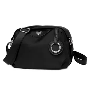 Black nylon crossbody bag for women, casual large capacity shoulder bag with zipper and logo.