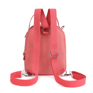 Pink oxford cloth women convertible backpack, multi-way shoulder bag, stylish casual daypack.