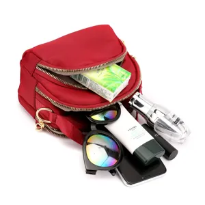 Red canvas multi-pocket crossbody bag for women, stylish casual shoulder bag with zippers.
