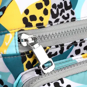 Trendy nylon crossbody bag with colorful abstract leopard print and sturdy metal zipper pull.