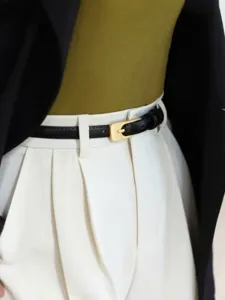 Women's slim black leather belt with gold buckle detail, minimalist dress waist accessory