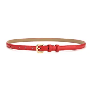 Close-up detail of the slim red leather belt featuring a sleek gold-toned metal buckle.
