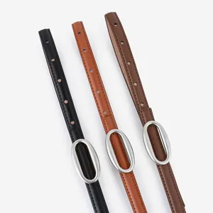 Slim leather belt for women with elegant oval metal buckle, versatile casual accessory.