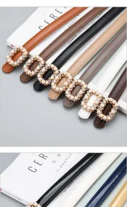 Women's thin leather dress belt with pearl rhinestone buckle, stylish waist accessory.